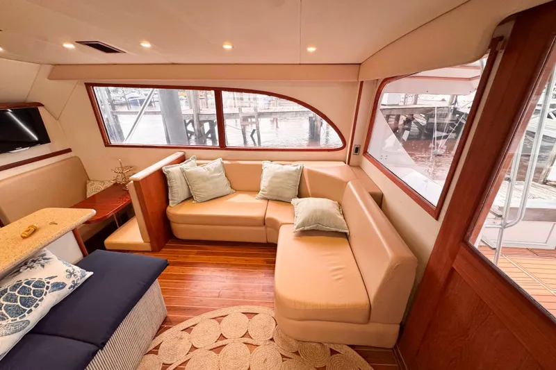 Slide: The Image of Luxurious interior of a 1989 Buddy Davis 47 yacht with plush seating and elegant decor. - 19