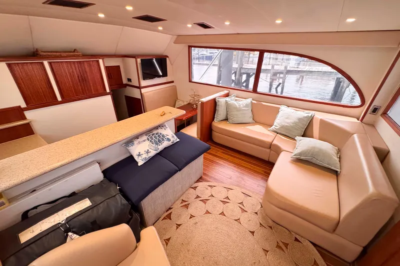 Slide: The Image of Luxurious interior of 1989 Buddy Davis 47 yacht with cozy seating and elegant decor. - 20