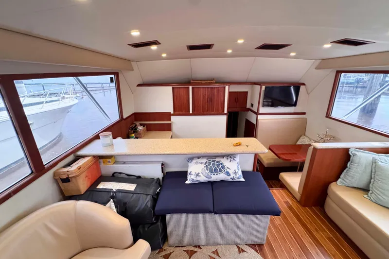 Slide: The Image of Interior of 1989 Buddy Davis 47 yacht with modern seating and wooden accents. - 21