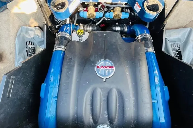 Slide: The Image of Engine of 2019 Mastercraft X26 boat with Ilmor branding and blue components. - 10