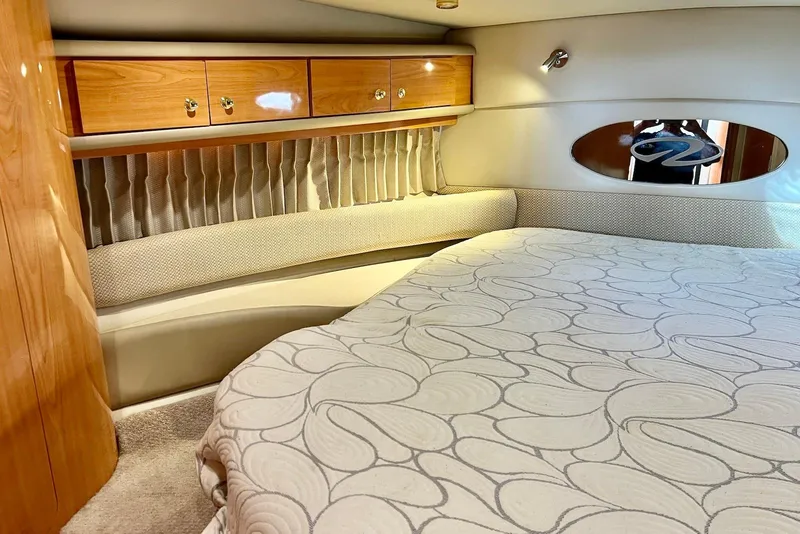 Slide: The Image of Luxurious interior of 2000 Regal Commodore 4160 yacht with elegant wood cabinetry. - 19