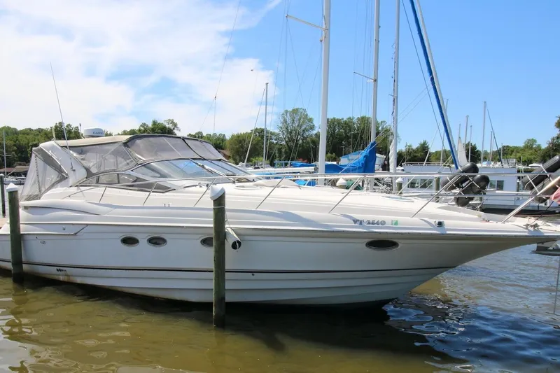 Slide: The Image of 2000 Regal Commodore 4160 yacht docked at marina on a sunny day. - 2