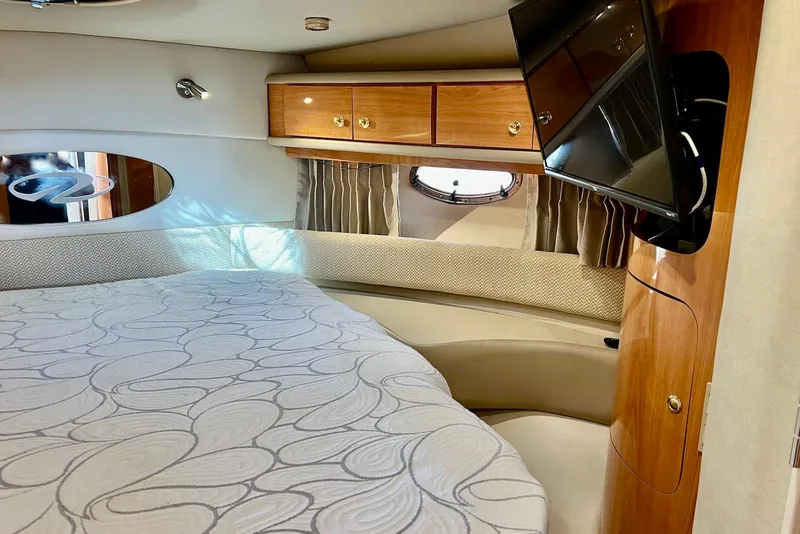 Slide: The Image of Luxurious cabin interior of 2000 Regal Commodore 4160 yacht with bed and TV. - 21
