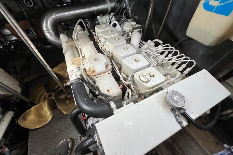 Slide: The Image of Engine compartment of a 2000 Regal Commodore 4160 boat, showcasing mechanical components. - 27