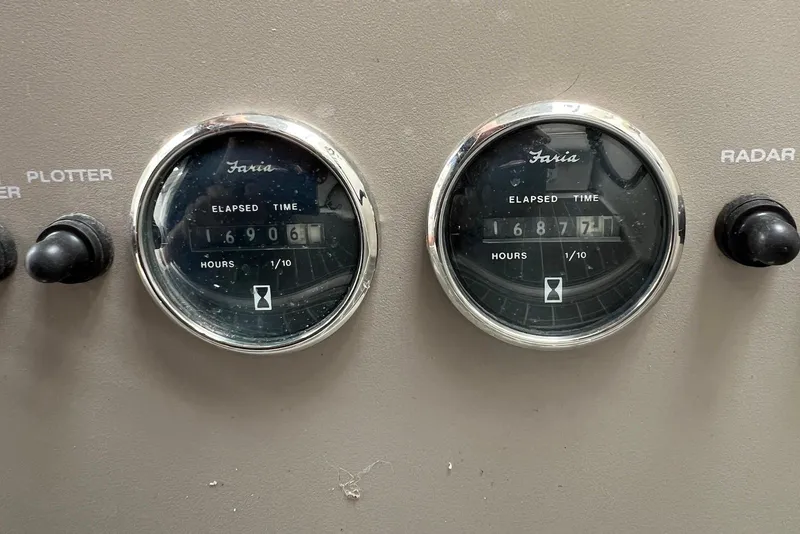 Slide: The Image of Close-up of Faria elapsed time gauges on a 2000 Regal Commodore 4160 boat. - 30