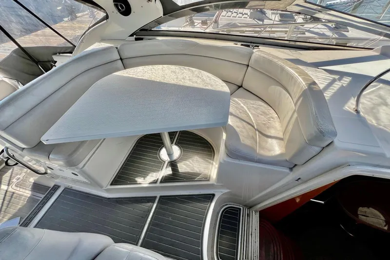 Slide: The Image of Luxurious seating area on a 2000 Regal Commodore 4160 yacht with a sleek table. - 8