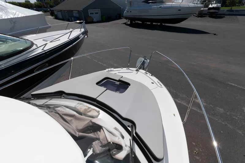 Slide: The Image of 2020 Jeanneau NC 695 boat on display in a marina setting. - 9