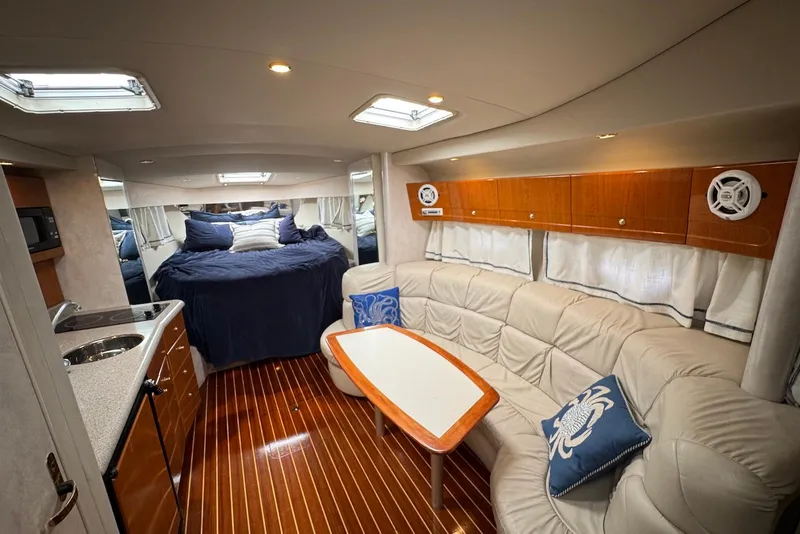 Slide: The Image of Luxurious interior of a 2002 Formula 37 Performance Cruiser with cozy seating and elegant wood finishes. - 11