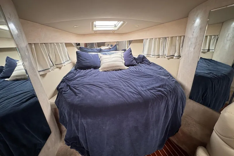 Slide: The Image of Luxurious cabin interior of 2002 Formula 37 Performance Cruiser with plush bedding. - 15