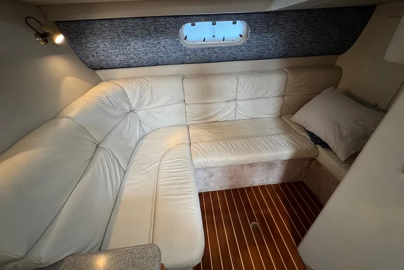 Slide: The Image of Interior of 2002 Formula 37 Performance Cruiser with white leather seating and wood flooring. - 16