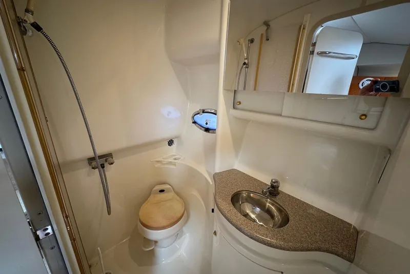 Slide: The Image of 2002 Formula 37 Performance Cruiser bathroom with shower, sink, and toilet. - 17
