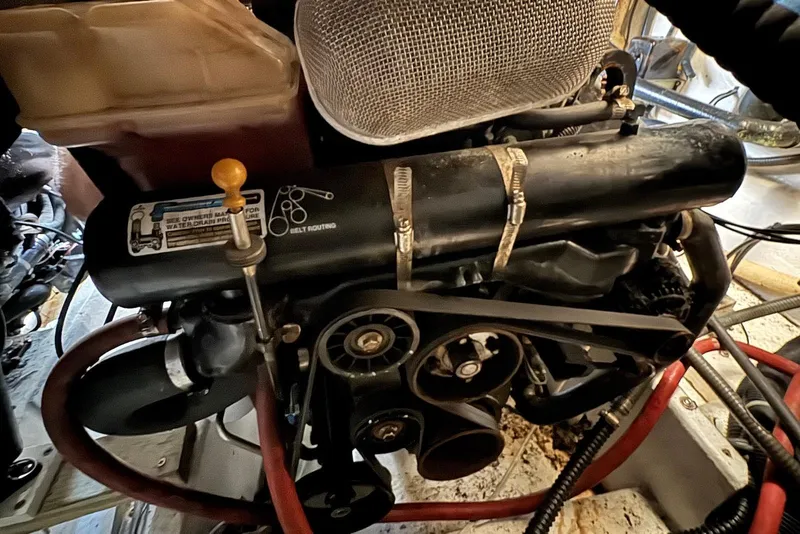 Slide: The Image of Engine compartment of a 2002 Formula 37 Performance Cruiser with visible belts and hoses. - 20