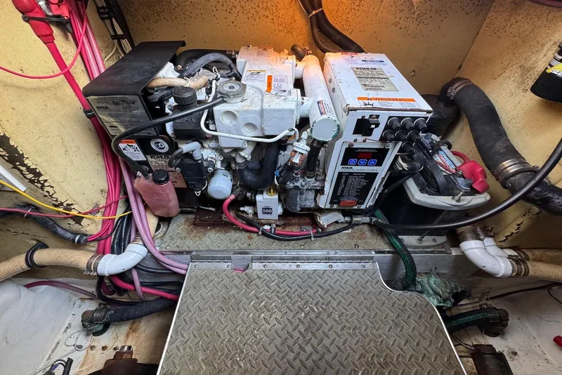 Slide: The Image of Engine room of a 2002 Formula 37 Performance Cruiser with visible wiring and machinery. - 21