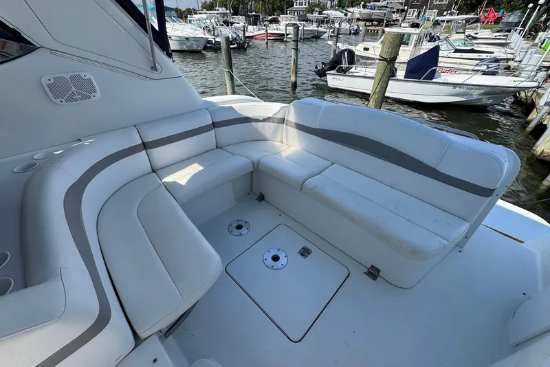 Slide: The Image of 2002 Formula 37 Performance Cruiser with spacious seating at marina dock. - 4