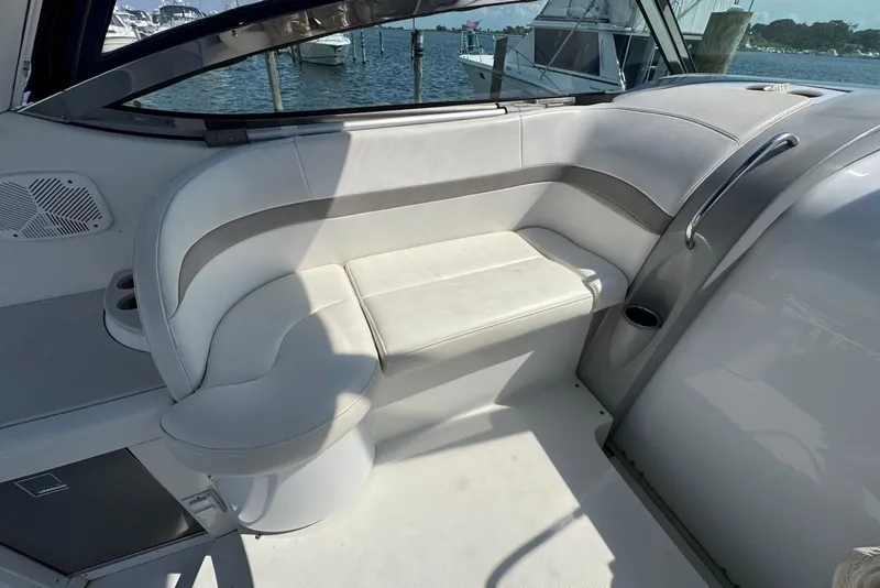 Slide: The Image of 2002 Formula 37 Performance Cruiser interior with white seating and waterfront view. - 5