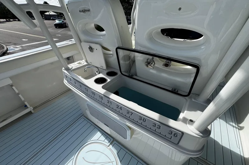 Slide: The Image of 2015 Sailfish 320 CC boat with fishing station and built-in sink. - 20