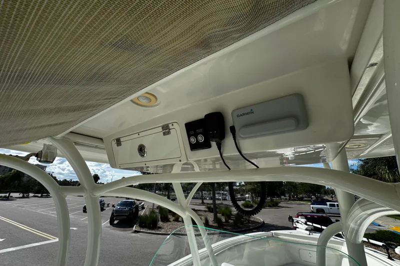 Slide: The Image of 2015 Sailfish 320 CC boat with Garmin electronics and storage compartment. - 29