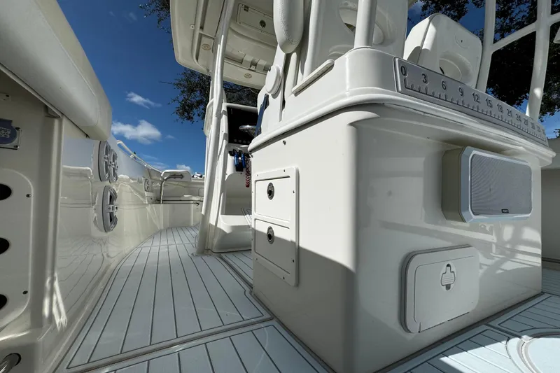 Slide: The Image of 2015 Sailfish 320 CC boat interior with sleek white design and modern features. - 33
