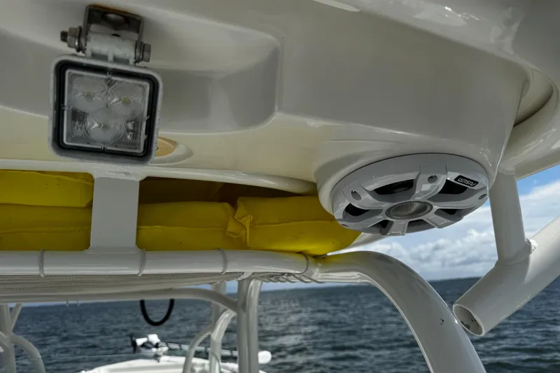 Slide: The Image of 2015 Sailfish 320 CC boat with speaker and light, ocean background. - 57