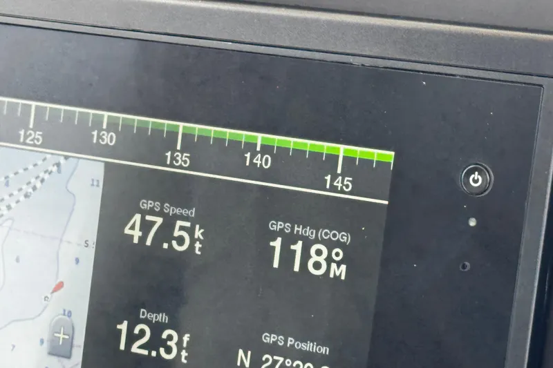 Slide: The Image of Display screen showing GPS speed, heading, and depth on a 2015 Sailfish 320 CC boat. - 61