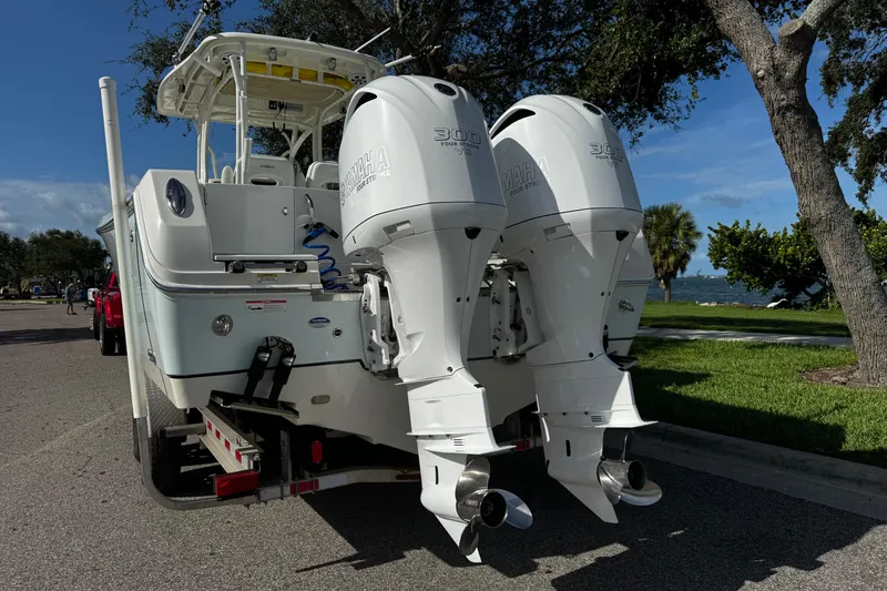 Slide: The Image of 2015 Sailfish 320 CC boat with dual Yamaha outboard motors on a trailer. - 7