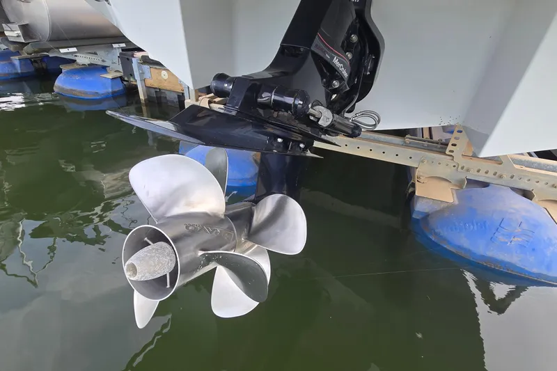 Slide: The Image of 2021 Cobalt R5 boat propeller and outdrive in water, showcasing marine engineering. - 12