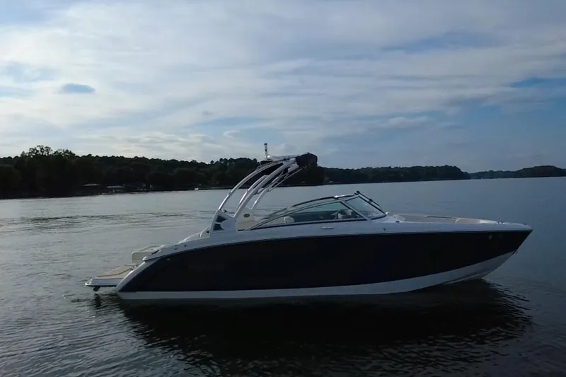 Slide: The Image of 2021 Cobalt R5 boat on a calm lake under a cloudy sky. - 19