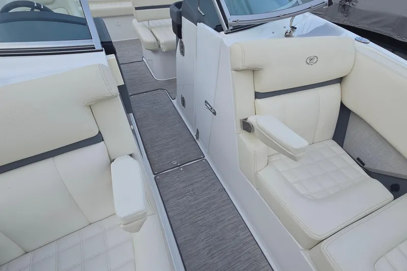 Slide: The Image of 2021 Cobalt R5 boat interior with luxurious white seating and modern design. - 26