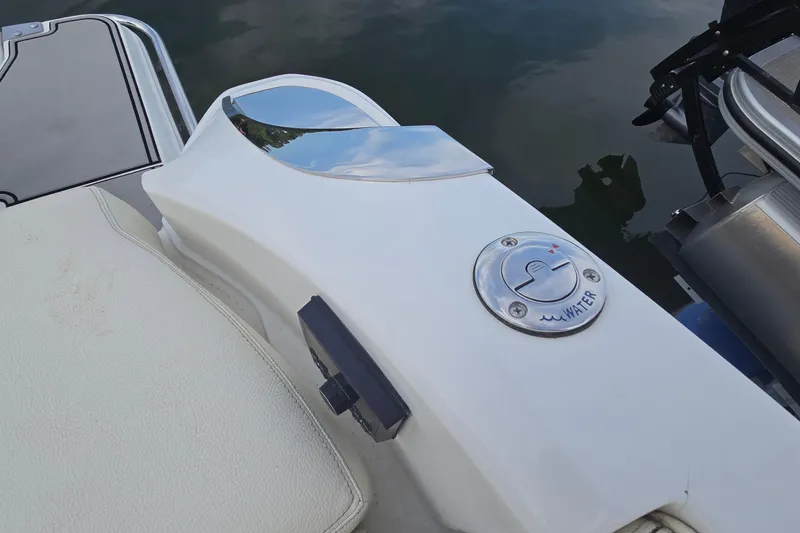 Slide: The Image of 2021 Cobalt R5 boat deck with water access panel and chrome accents. - 36