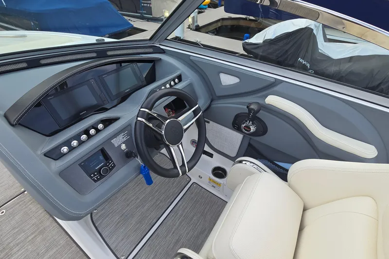 Slide: The Image of 2021 Cobalt R5 boat interior with modern dashboard and steering wheel. - 37