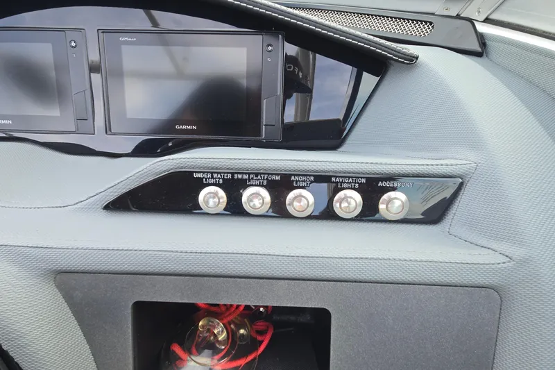 Slide: The Image of Dashboard of 2021 Cobalt R5 boat with Garmin displays and light controls. - 39