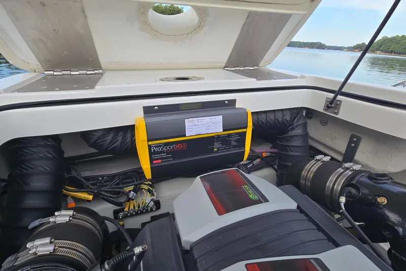 Slide: The Image of 2021 Cobalt R5 boat engine compartment with ProSportHD20 charger, lake view. - 40