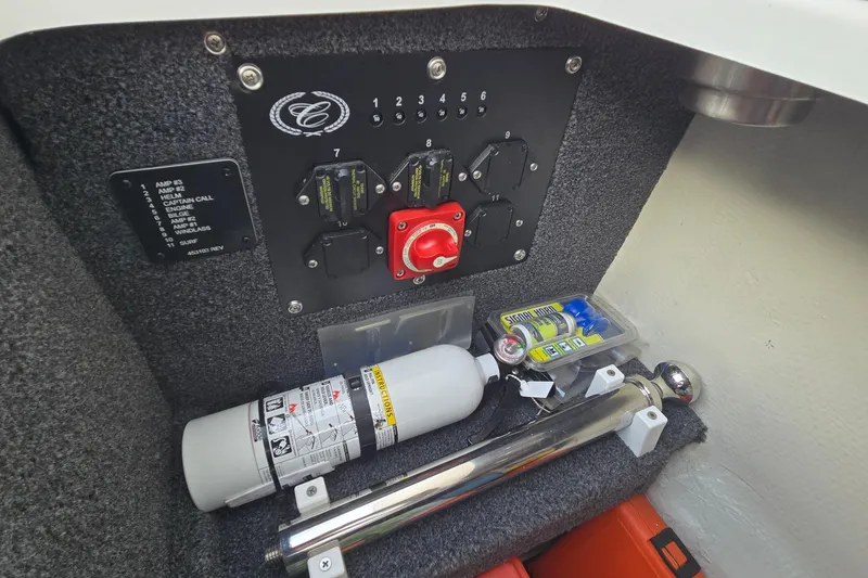 Slide: The Image of 2021 Cobalt R5 boat interior with control panel and safety equipment. - 46