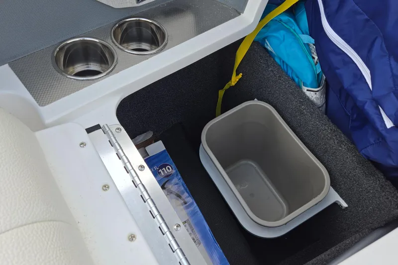 Slide: The Image of 2021 Cobalt R5 boat interior storage with cup holders and container. - 50