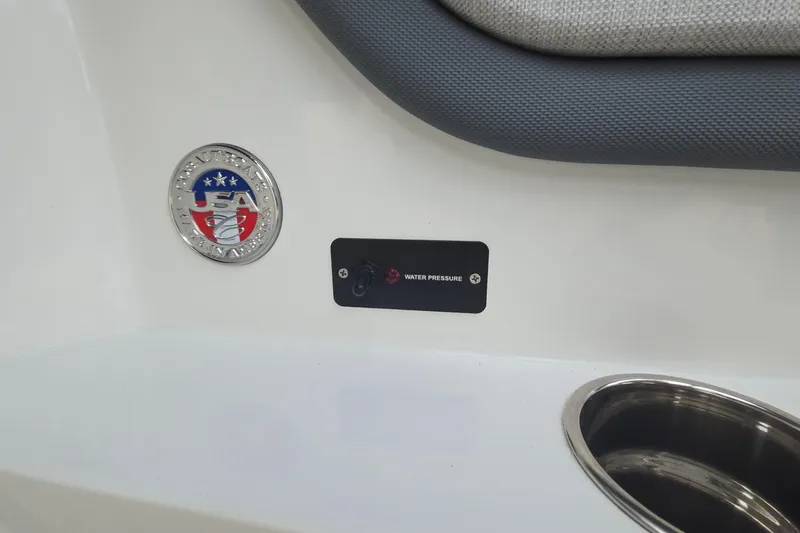 Slide: The Image of 2021 Cobalt R5 boat detail with USA emblem and water pressure control. - 53
