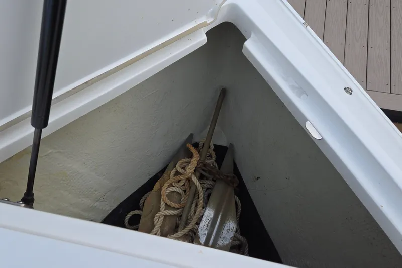 Slide: The Image of Storage compartment of 2021 Cobalt R5 boat with anchor and ropes. - 55