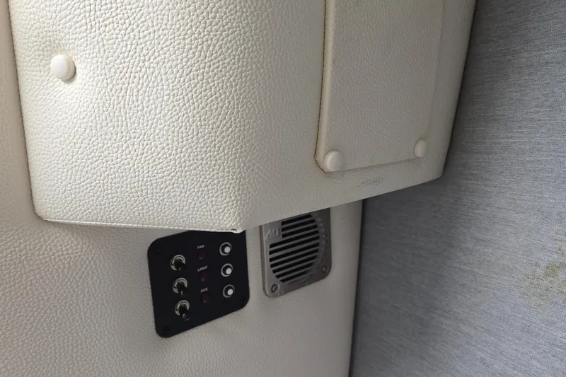 Slide: The Image of 2021 Cobalt R5 interior panel with control switches and speaker. - 56