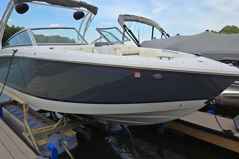 Slide: The Image of 2021 Cobalt R5 boat docked, featuring sleek design and modern amenities. - 6