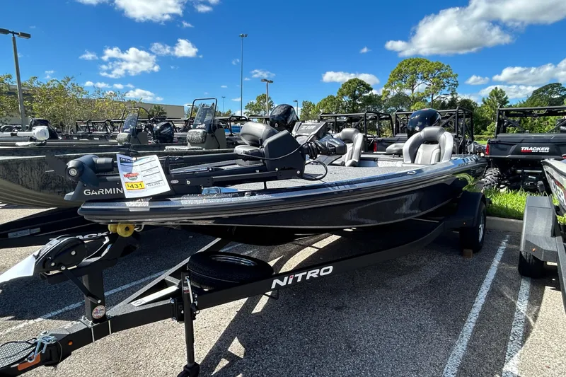 The Image of 2026 Nitro Z18 Pro boat on trailer in sunny dealership lot. - 0