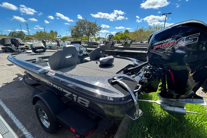 Slide: The Image of 2026 Nitro Z18 Pro boat with Mercury Pro XS engine, parked outdoors under blue sky. - 2