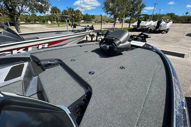 Slide: The Image of 2026 Nitro Z18 Pro boat deck with fishing seat and equipment, parked outdoors. - 4