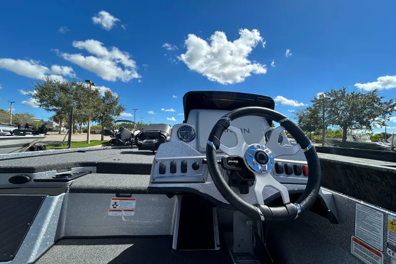 Slide: The Image of Steering console of a 2026 Nitro Z18 Pro boat under a clear blue sky. - 7
