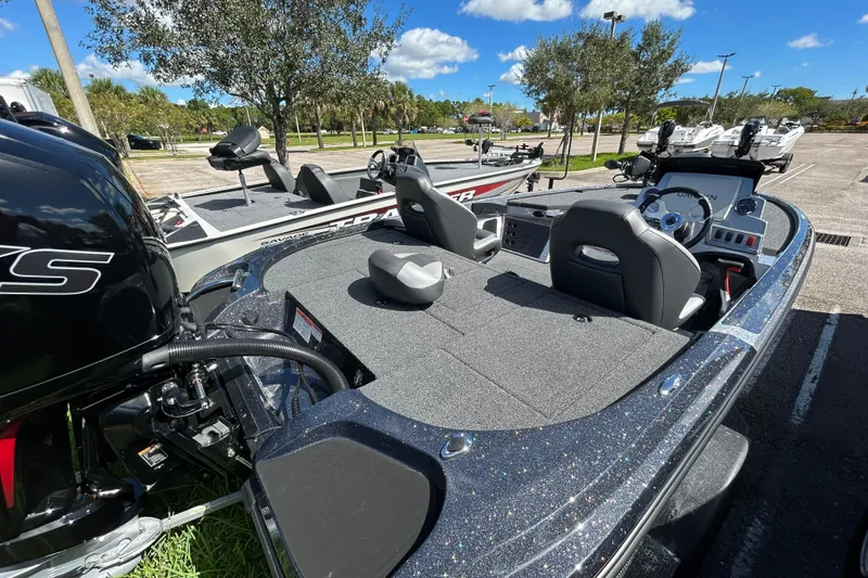 Slide: The Image of 2026 Nitro Z18 Pro boat with sleek design and modern features in a sunny parking lot. - 9