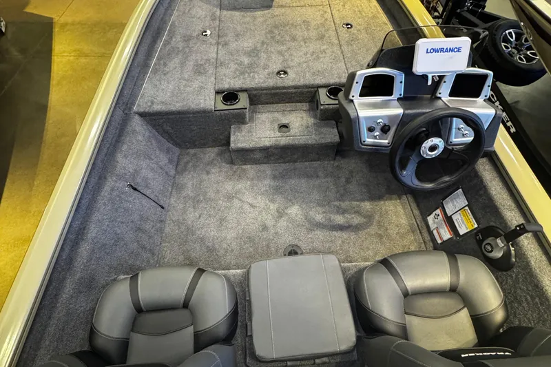 Slide: The Image of 2026 Tracker Pro Team 190 boat interior with steering wheel and Lowrance electronics. - 3