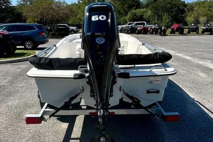 Slide: The Image of 2026 Mako Pro Skiff 15 CC boat with Mercury 60 engine on trailer. - 6