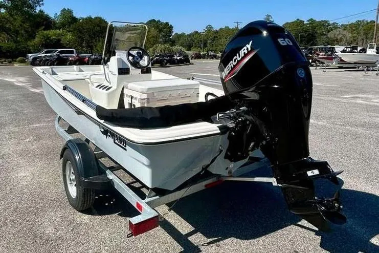 Slide: The Image of 2026 Mako Pro Skiff 15 CC boat on trailer with Mercury 60 outboard motor. - 7