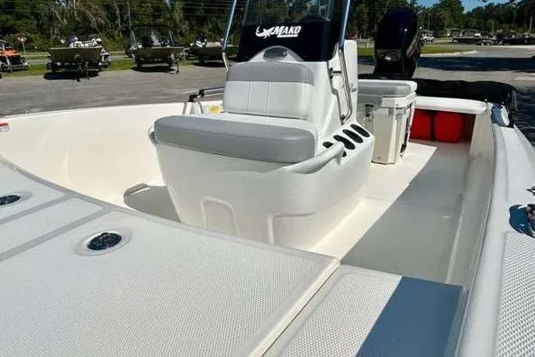 Slide: The Image of 2026 Mako Pro Skiff 15 CC boat interior with seating and storage compartments. - 8