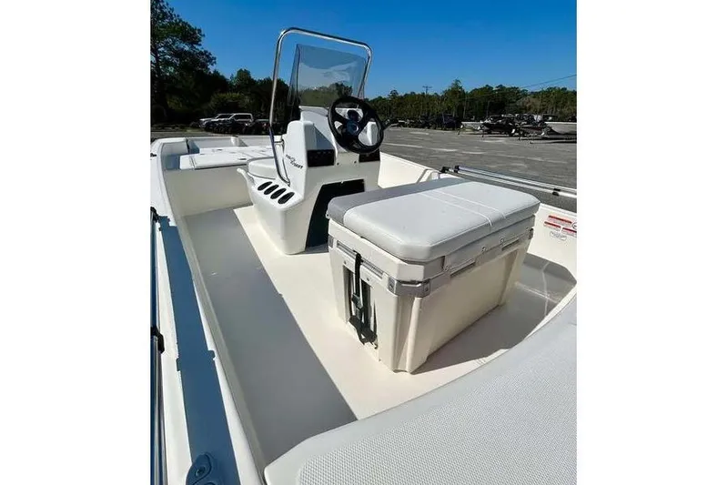 Slide: The Image of 2026 Mako Pro Skiff 15 CC boat interior with console and seating. - 9