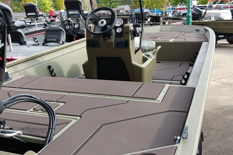 Slide: The Image of 2026 Tracker Grizzly 1860 CC boat with spacious deck and modern console. - 3