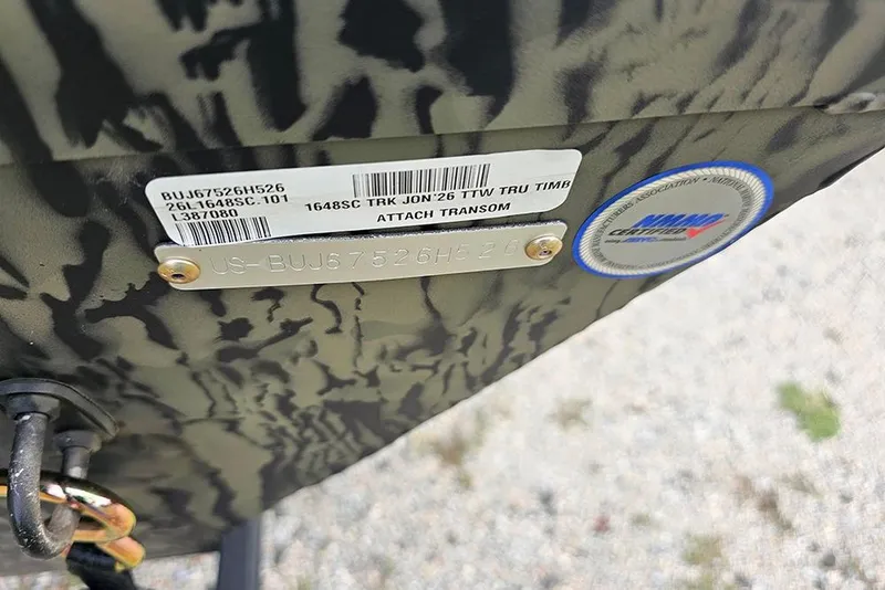 Slide: The Image of 2026 Tracker Grizzly 1648 SC boat identification plate with camouflage pattern. - 15